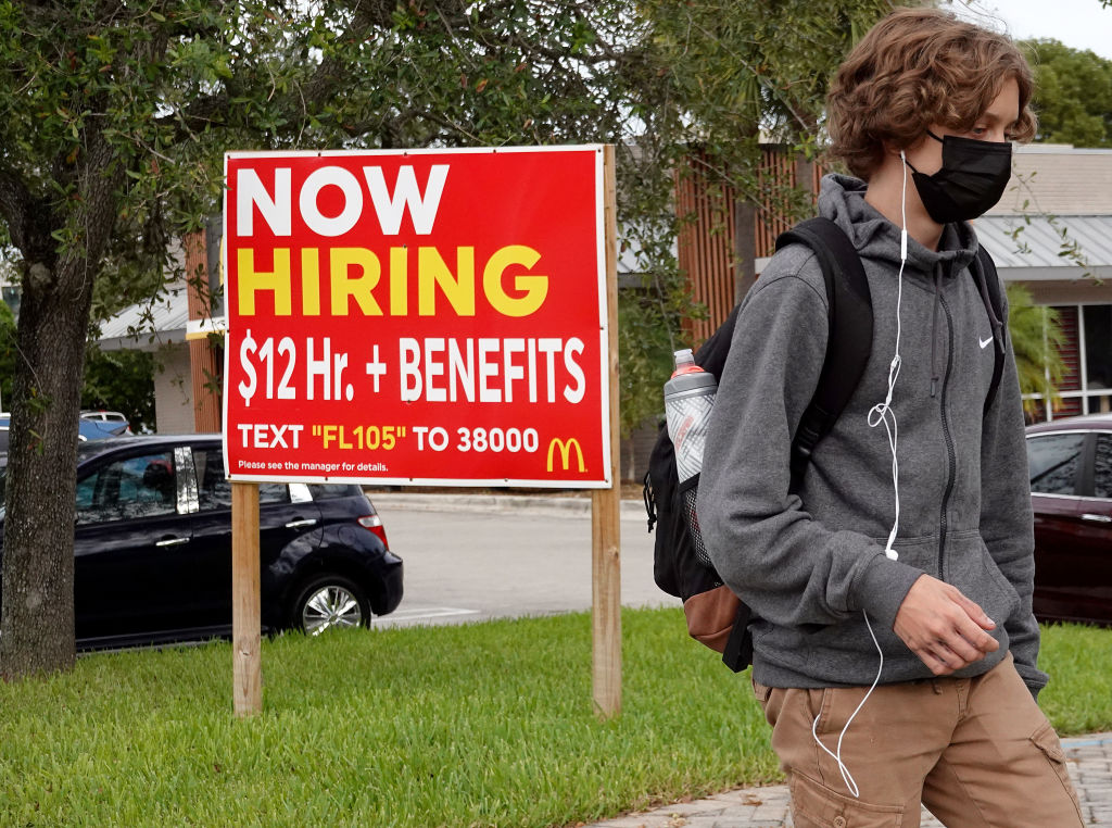 'Now hiring' was plastered on signs and store windows across the U.S. in 2021, as businesses grappled with a tight labor market and high consumer demand. (Joe Raedle—Getty Images)