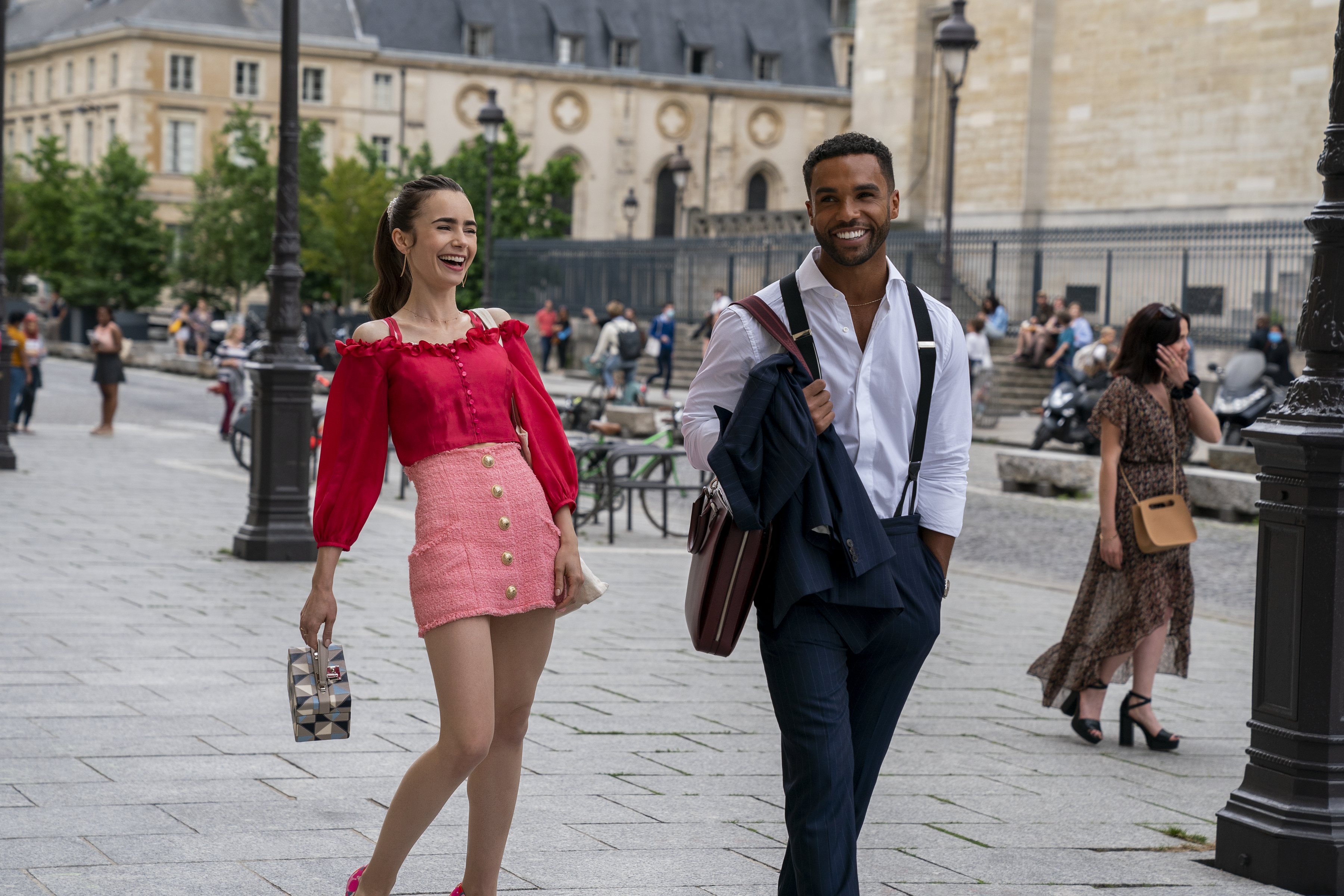 Lily Collins as Emily and Lucien Laviscount as Alfie in season 2 of 'Emily in Paris.' (STÉPHANIE BRANCHU/NETFLIX&mdash;© 2021 Netflix, Inc.)