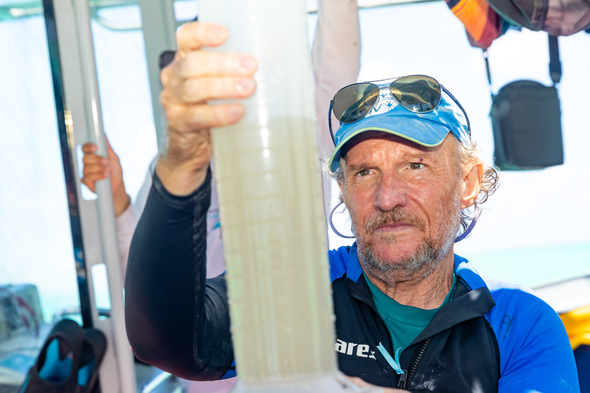 Professor Peter Harrison, pioneer of Coral IVF, measuring coral larvae concentrations at Heron Island in Australia. (Southern Cross University)