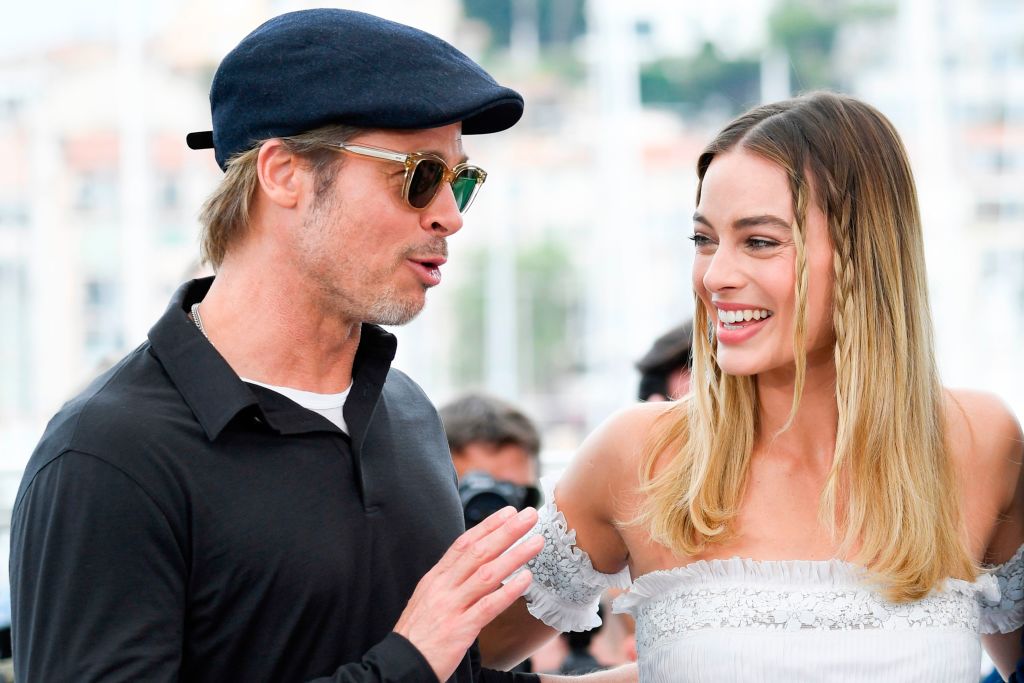 Brad Pitt and Margot Robbie pose during a photocall for the film 