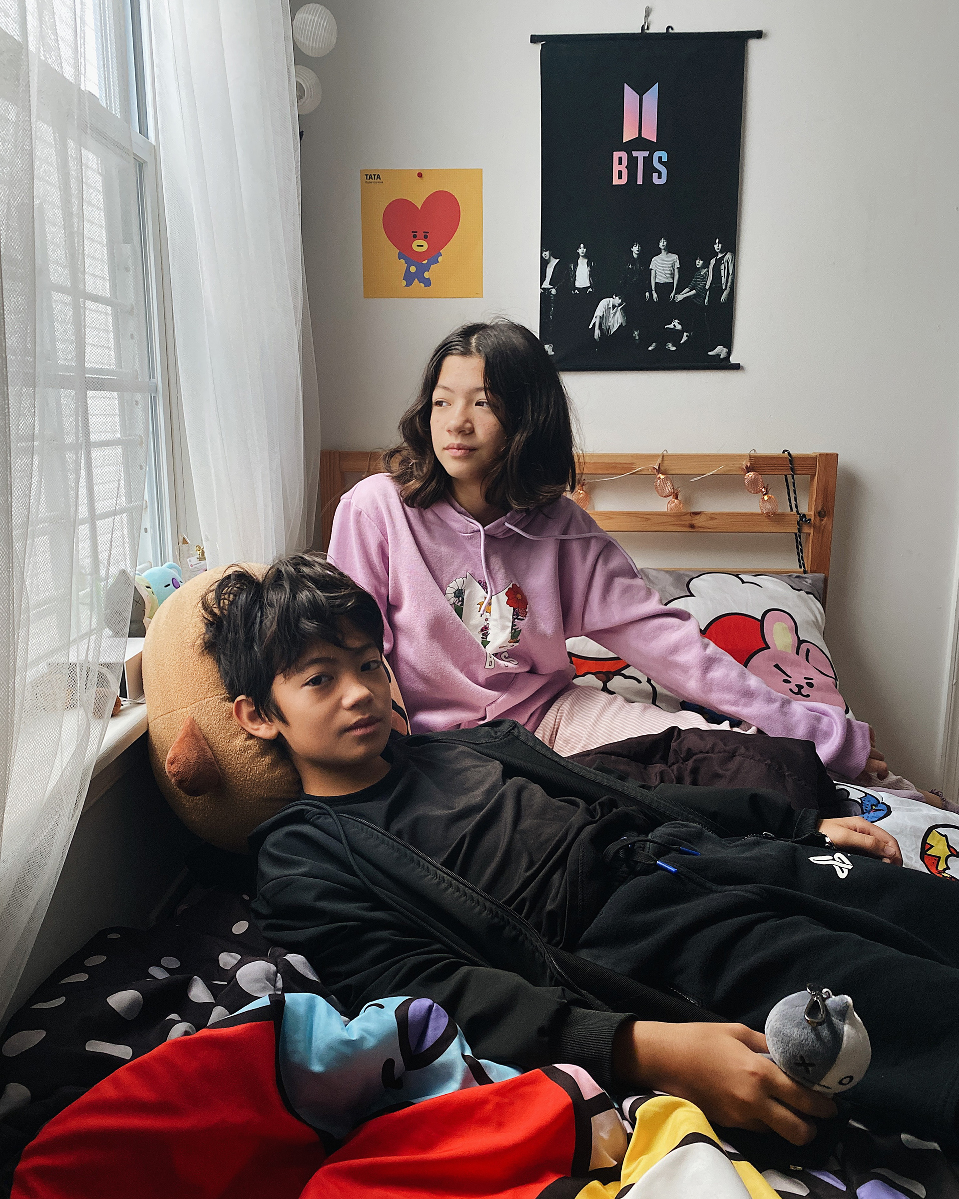 <strong>Jackson and Charlotte</strong>. "<a href="https://time.com/6122609/bts-army-photos/">These Portraits Show That the BTS ARMY Is Not a Monolith</a>," Nov. 24. (Hannah Yoon for TIME)