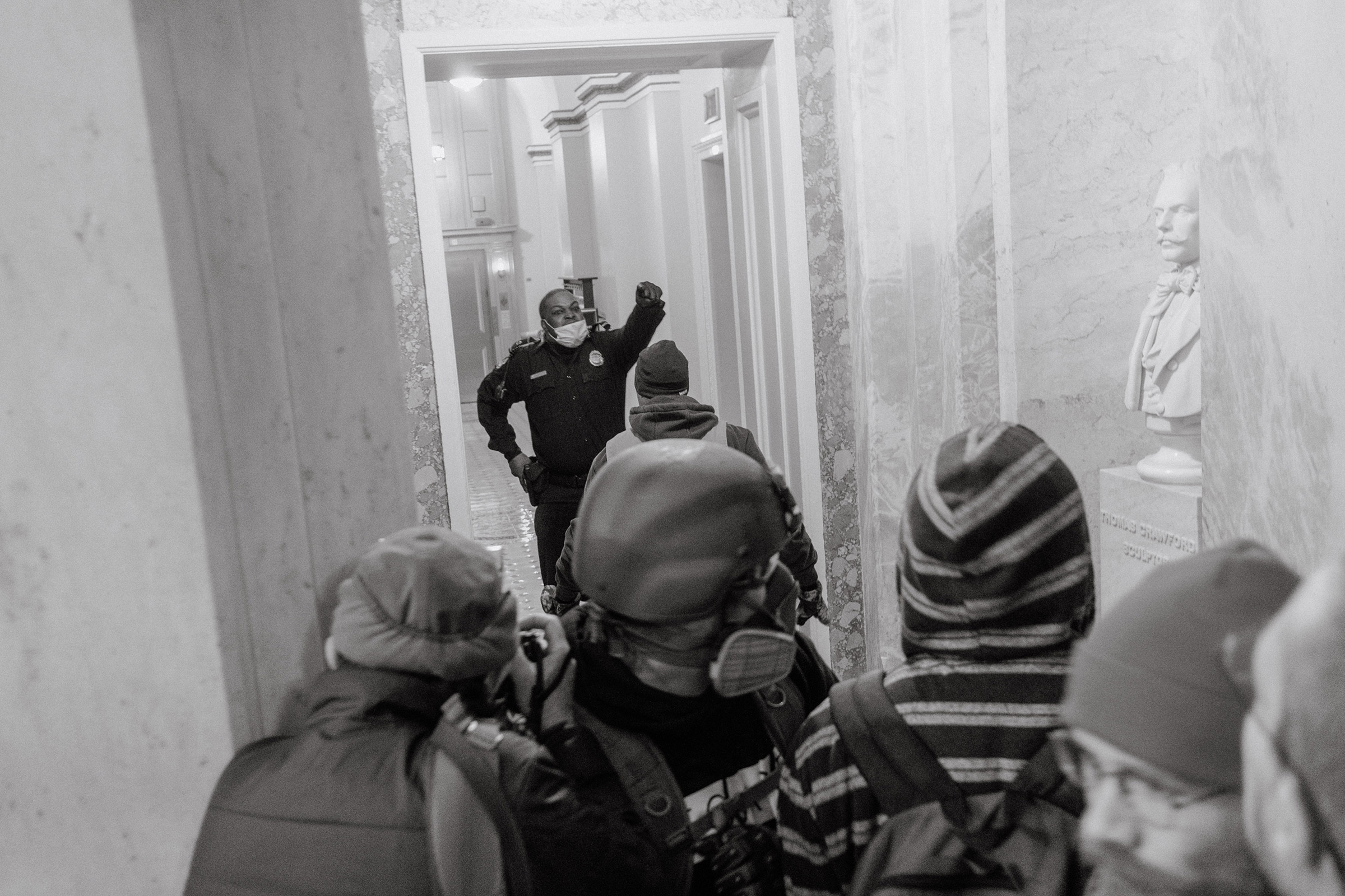 Capitol Police officer Eugene Goodman confronts protesters as they storm the <a href="https://time.com/5927198/capitol-trump-rioters-photography/">Capitol</a> in Washington on Jan. 6. (Christopher Lee for TIME)