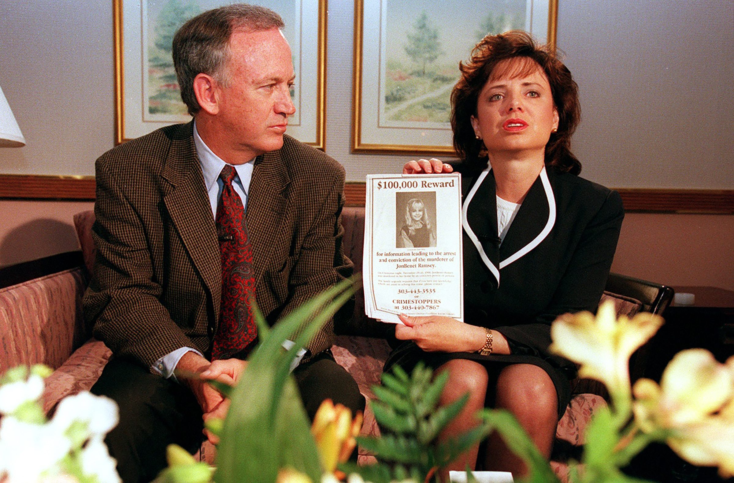 John and Patsy Ramsey, the parents of JonBenét Ramsey, meet with local Colorado media on May 1, 1997 in Boulder. Patsy holds up a reward sign for information leading to the arrest of their daughter's murderer. (Helen H. Richardson—The Denver Post/Getty Images)