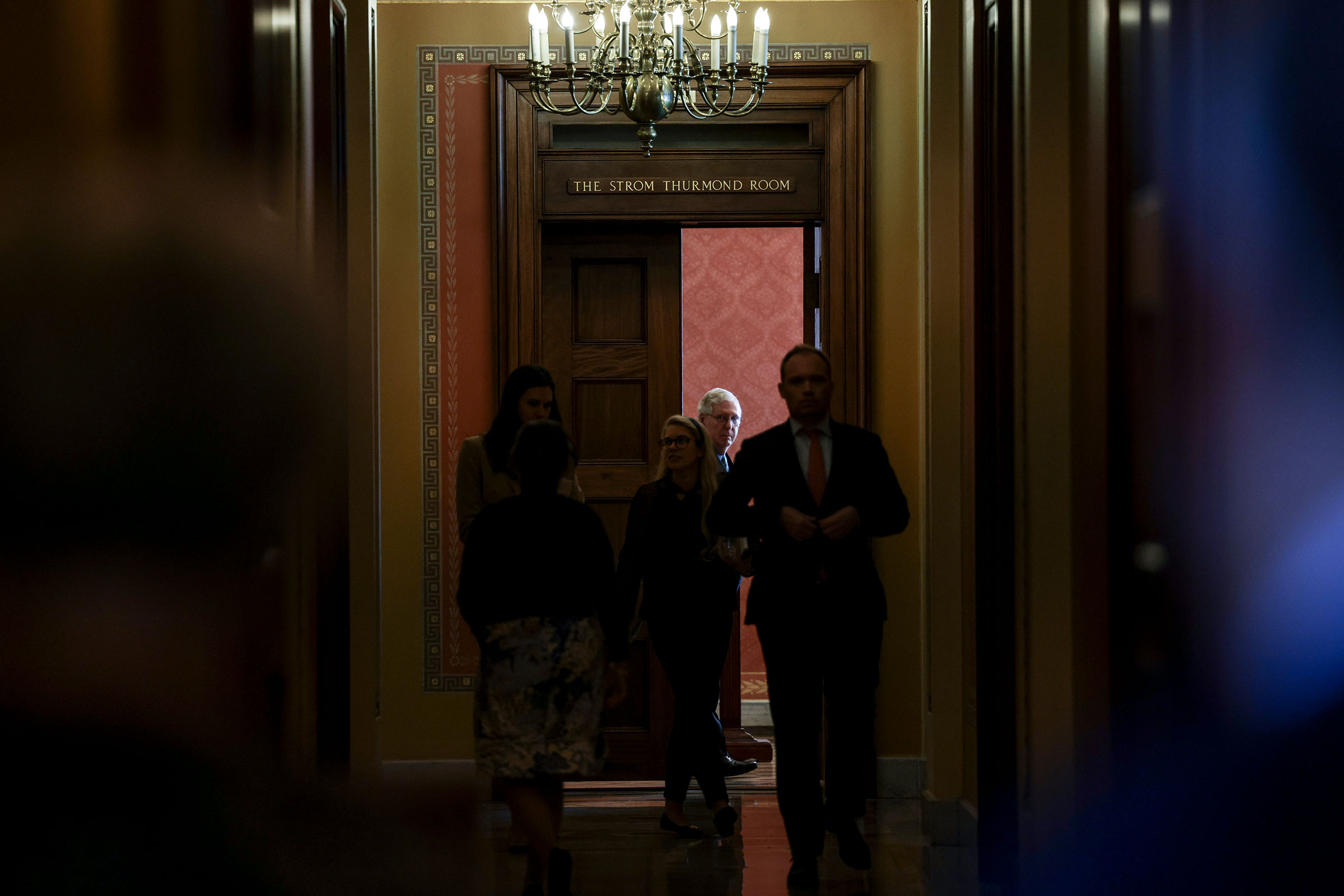 Senate Minority Leader Mitch McConnell watches Senators arrive to a meeting with Republican Senators on their party's plan for the vote on the debt limit at the Capitol on Oct. 7, 2021. (Anna Moneymaker—Getty Images)