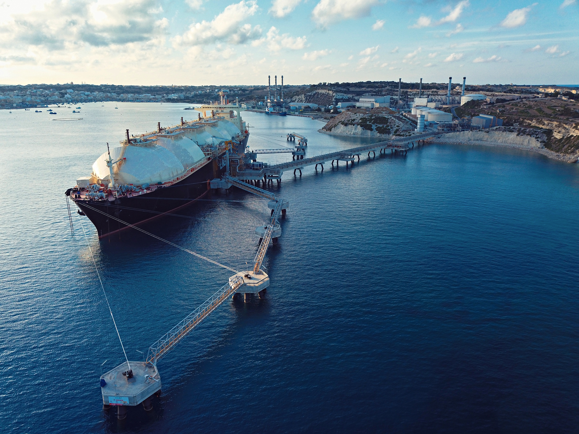 Aerial View Of A Liquefied Natural Gas (LNG) Tanker Moored To The Jetty
