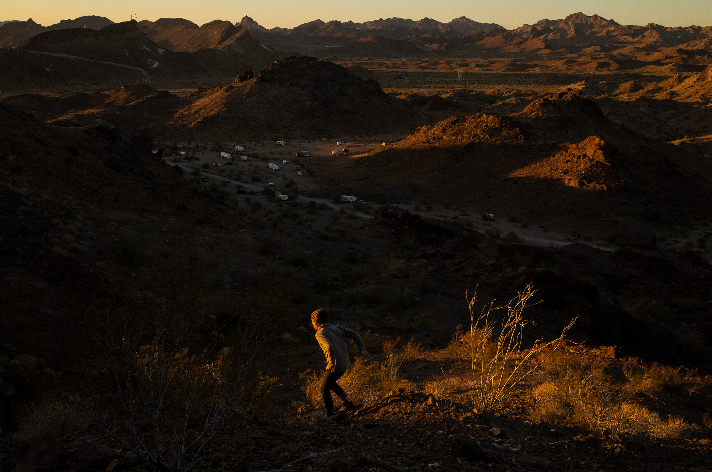 Max hikes above <a href="https://time.com/5950945/life-in-a-mobile-home/">Craggy Wash Campground</a> outside Lake Havasu City, Az. on Feb. 25. (Nina Riggio for TIME)