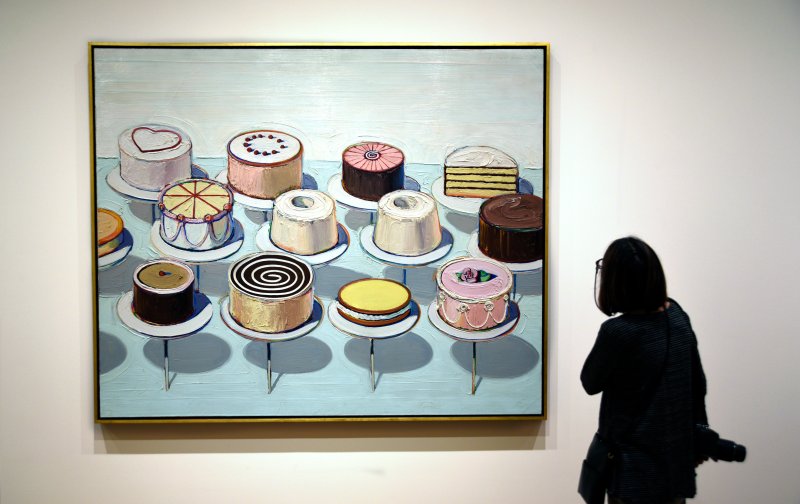 woman at museum looking at Thiebaud painting