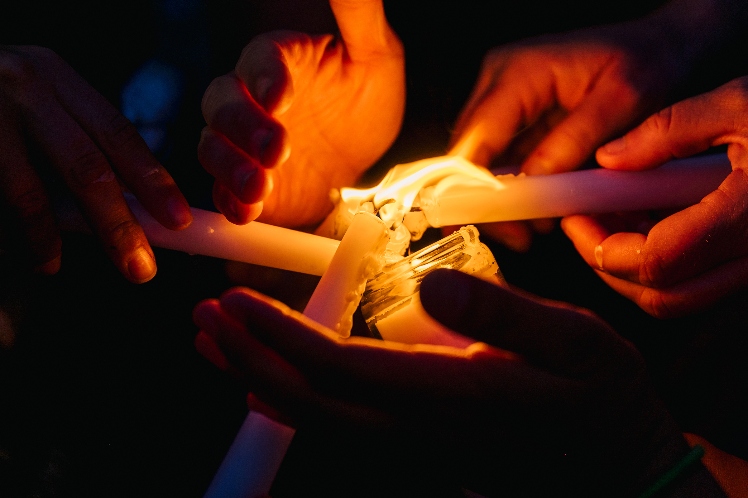 People celebrate the life of George Floyd by lighting candles at the intersection of 38th Street and Chicago Avenue on May 25, 2021, in Minneapolis. (Brandon Bell/Getty Images)