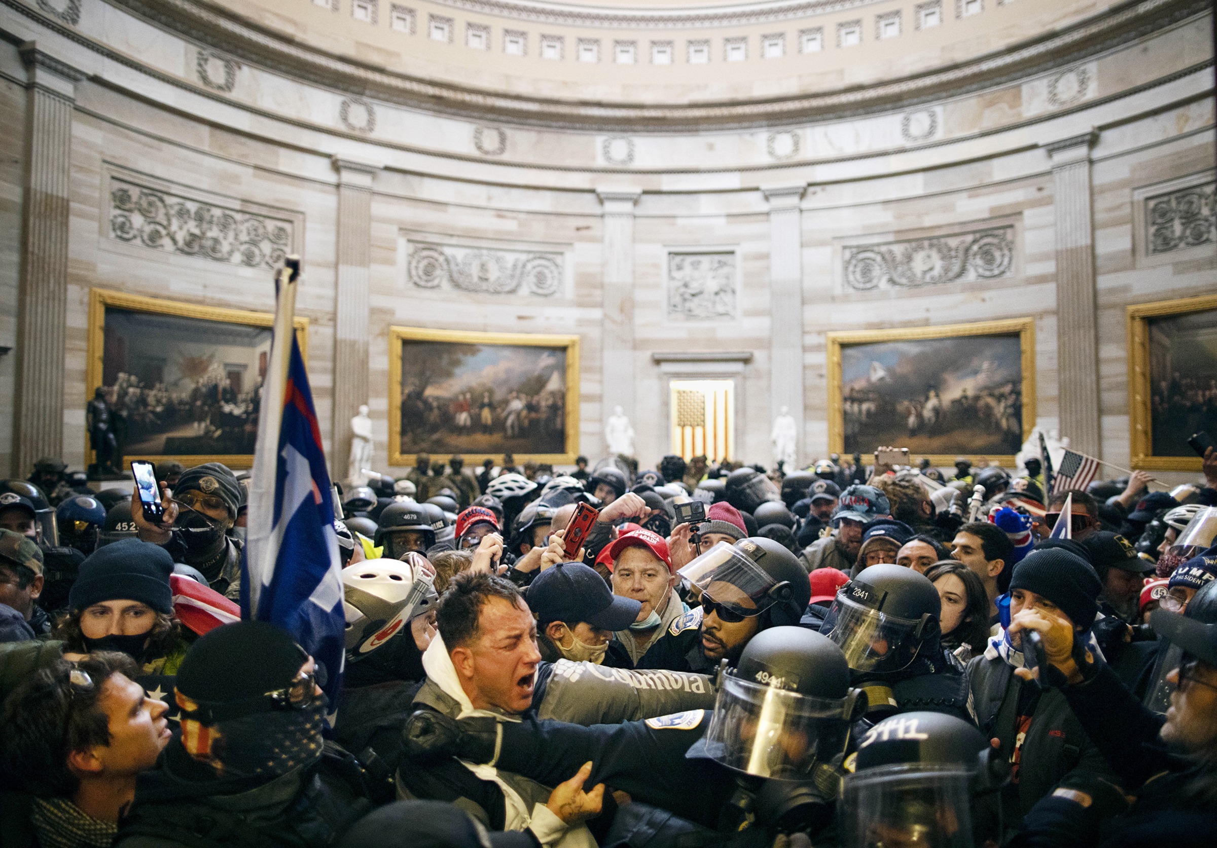 Police clash with Trump supporters in the Capitol rotunda after they breached the building on Jan. 6, 2021. (Mostafa Bassim—Anadolu Agency/Getty Images)
