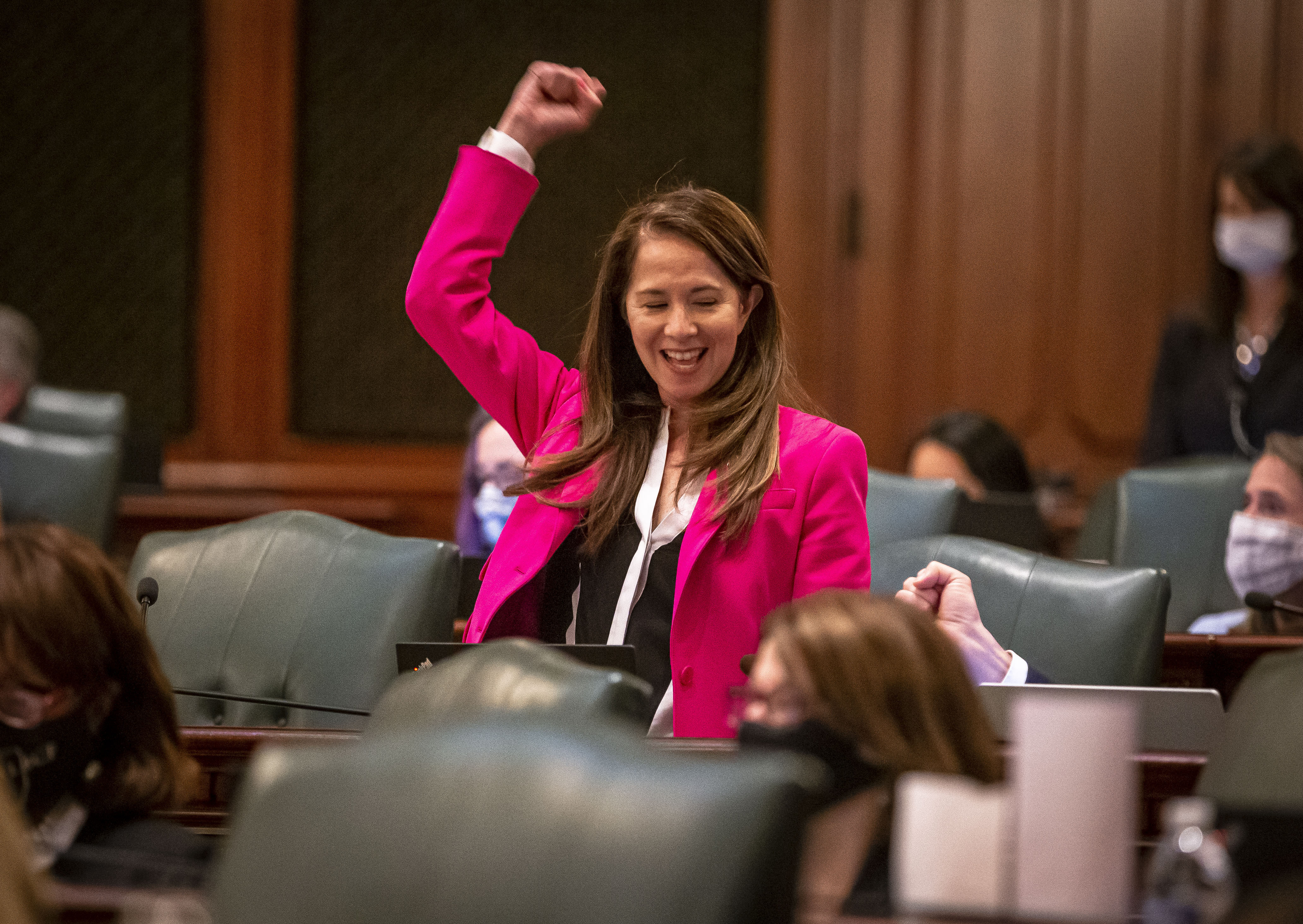 Illinois State Rep. Jennifer Gong-Gershowitz, D-Glenview, celebrates passage of a bill that requires public schools to teach Asian American history, on the floor of the Illinois House of Representatives in Springfield, Ill., on May 31, 2021. (Justin L. Fowler—State Journal-Register/AP)