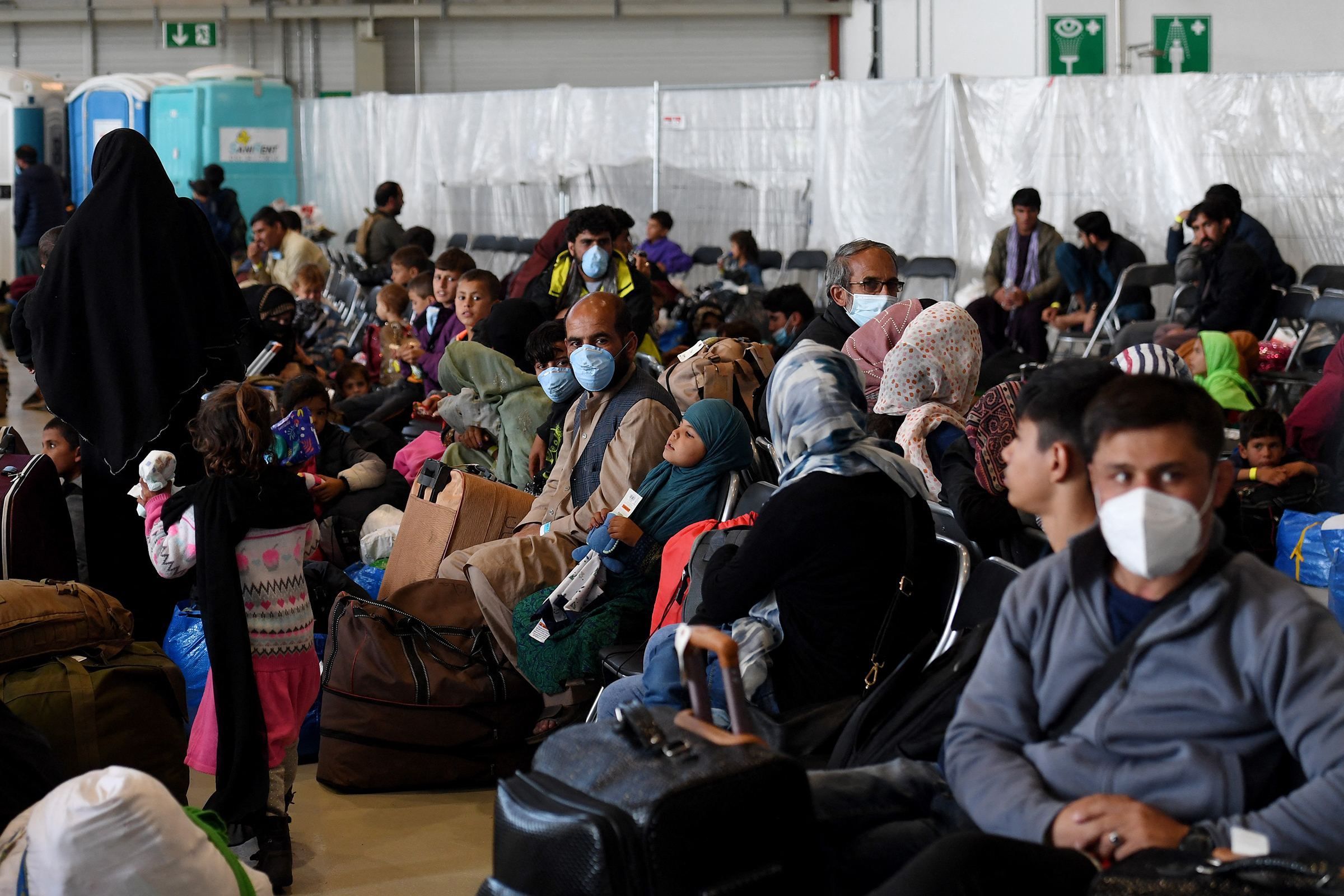 Afghan refugees are being processed inside Hangar 5 at Ramstein Air Base in Germany on September 8, 2021. (Photo by Olivier Douliery—Getty Images)
