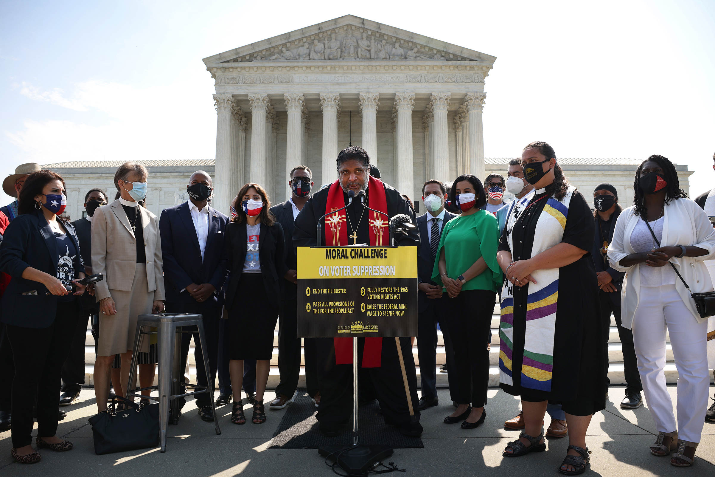 WASHINGTON, DC - AUGUST 12: Rev. William Barber, Co-Chair of the Poor People’s Campaign, speaks alongside Texas State Representatives and fellow religious leaders, as they prepare to deliver a petition to Senate Majority Leader Charles Schumer calling for an end to the filibuster, the passage of the For The People Act and restoring the Voting Rights Act, at the U.S. Supreme Court on August 12, 2021 in Washington, DC. (Photo by Kevin Dietsch/Getty Images) (Getty Images—2021 Getty Images)