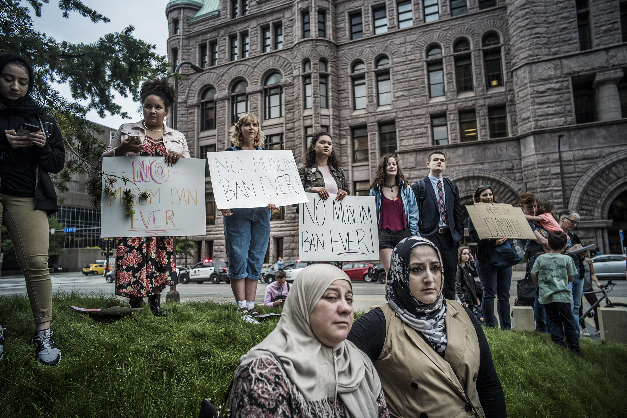 Protesters demonstrate their opposition to the Supreme Court's decision to uphold the Trump administration's travel ban on June 26, 2018, in Minneapolis. A new report from the nation’s largest Muslim civil rights group found that dozens of foundations and charities funded anti-Muslim groups between 2017 and 2019. (Richard Tsong-Taatarii—Star Tribune/AP)