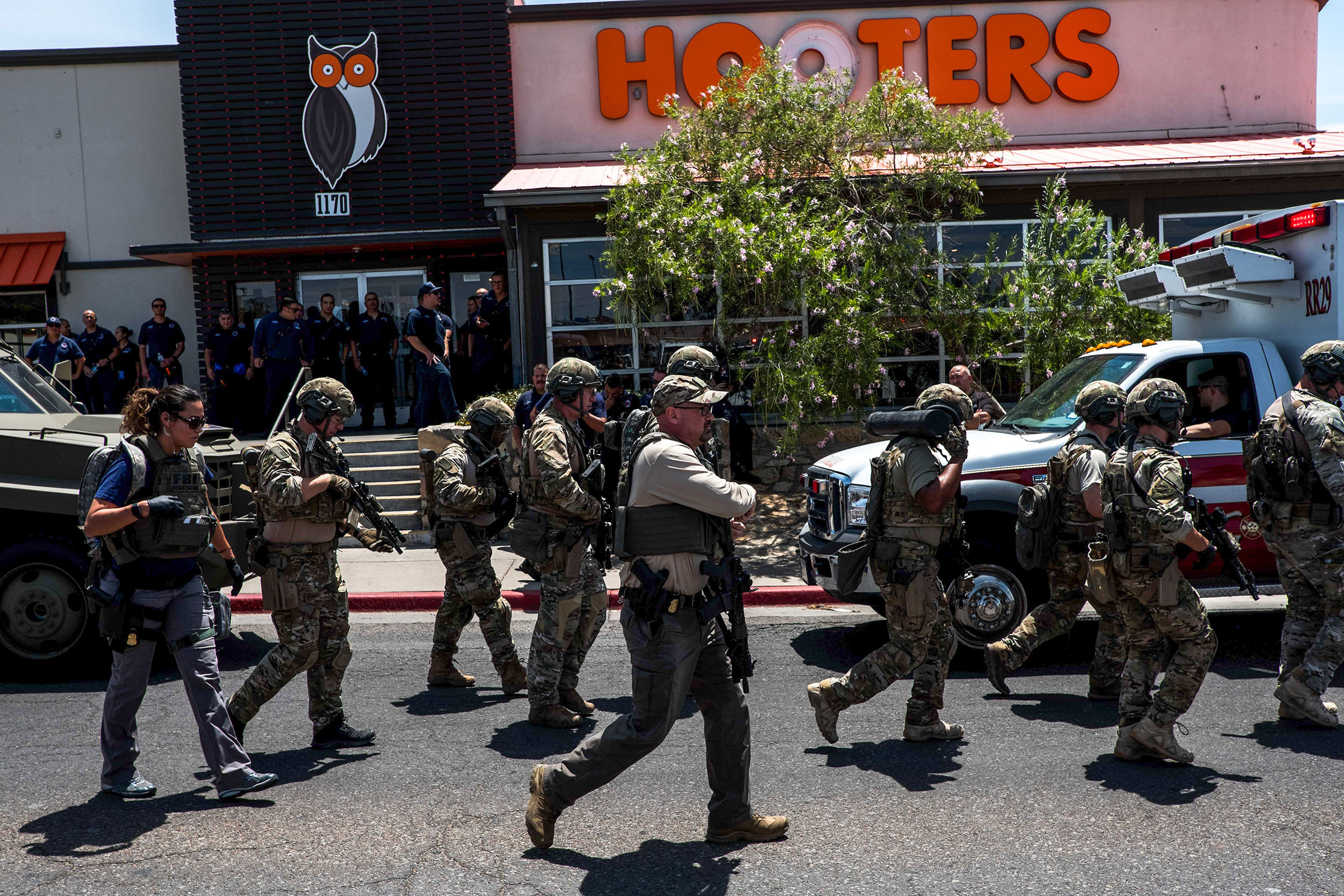 Law enforcement agencies respond to an active shooter at a Wal-Mart near Cielo Vista Mall in El Paso, Texas, Saturday, Aug. 3, 2019. - Police said there may be more than one suspect involved in an active shooter situation Saturday in El Paso, Texas. City police said on Twitter they had received "multi reports of multipe shooters." There was no immediate word on casualties. (Joel Angel—AFP/Getty Images)