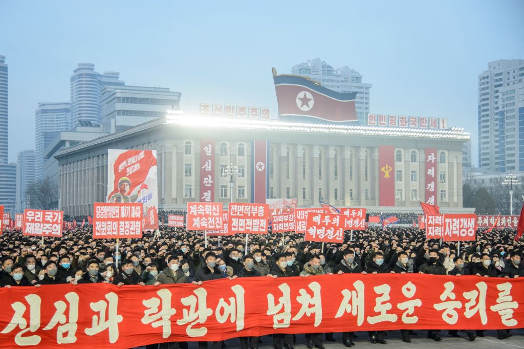 In this picture taken on January 5, 2022, people take part in a pro-government rally at Kim Il Sung Square in Pyongyang, North Korea (KIM WON JIN/AFP via Getty Images)