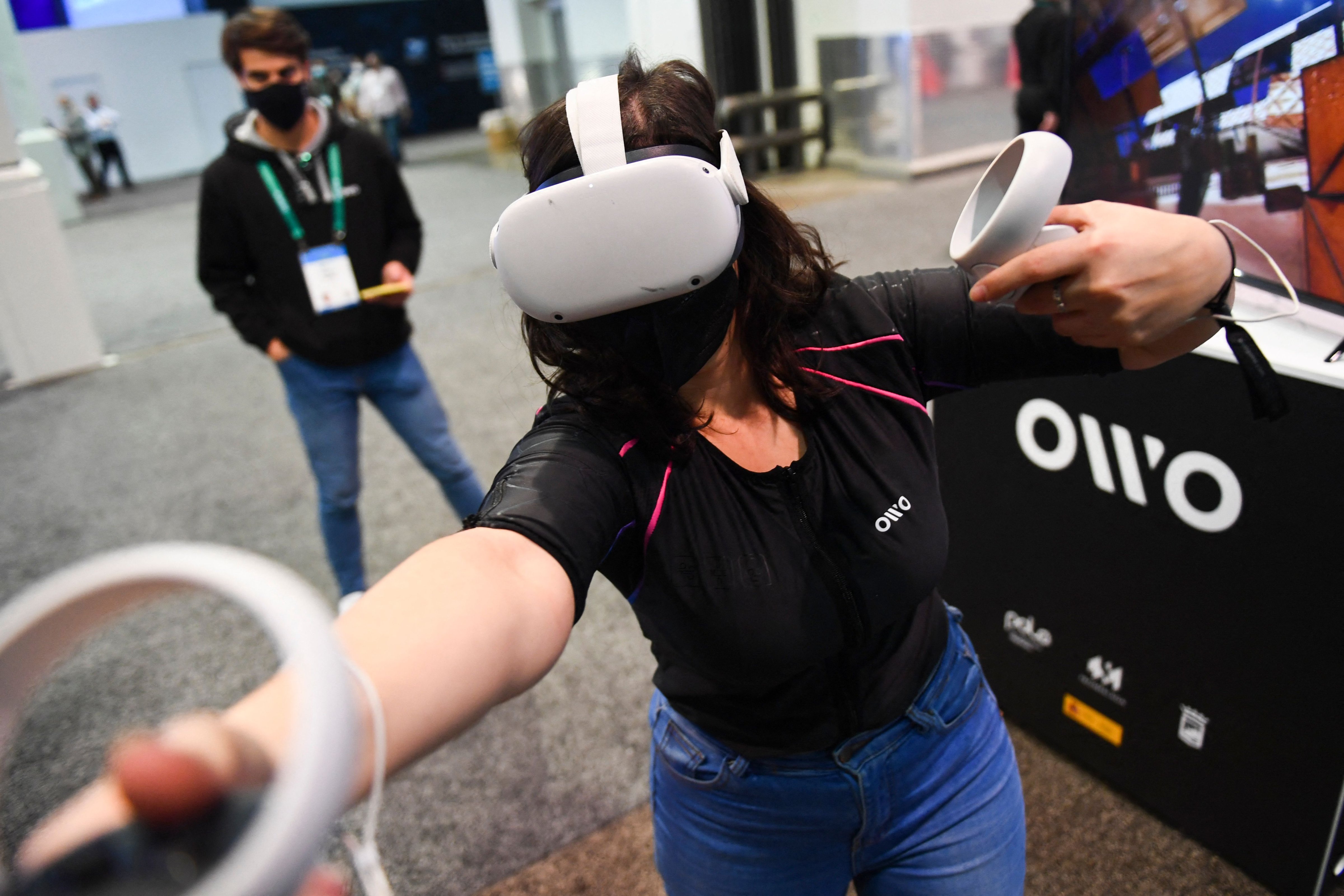 An attendee tries out the Owo vest the 2022 Consumer Electronics Show in Las Vegas, Nevada. (Patrick T. Fallon/AFP via Getty Images))