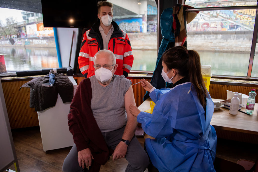 VIENNA, AUSTRIA - DECEMBER 01: A man gets a Covid-19 vaccination on the first day of a temporary vaccination center on the passenger ship MS Vindobona on Donaukanal (Danube Canal) on December 01, 2021 in Vienna, Austria. (Thomas Kronsteiner/Getty Images)