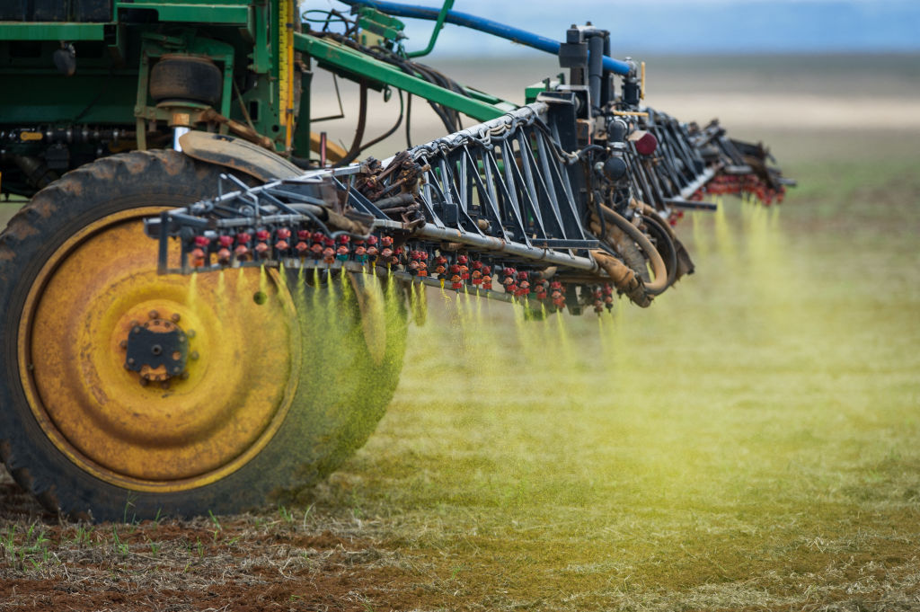 Herbicide is sprayed on a soybean field in the Cerrado plains near Campo Verde, Mato Grosso state, western Brazil on January 30, 2011. (YASUYOSHI CHIBA/AFP via Getty Images)