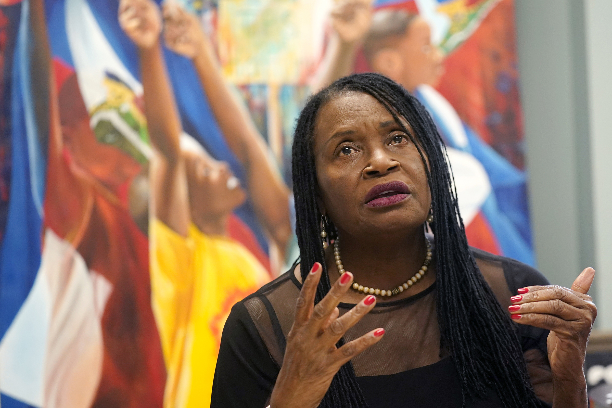 Marleine Bastien, Executive Director of the Family Action Network Movement (FAMM), speaks in Miami following the news that Haitian President Jovenel Moïse was assassinated on July 7, 2021. (Lynne Sladky—AP)