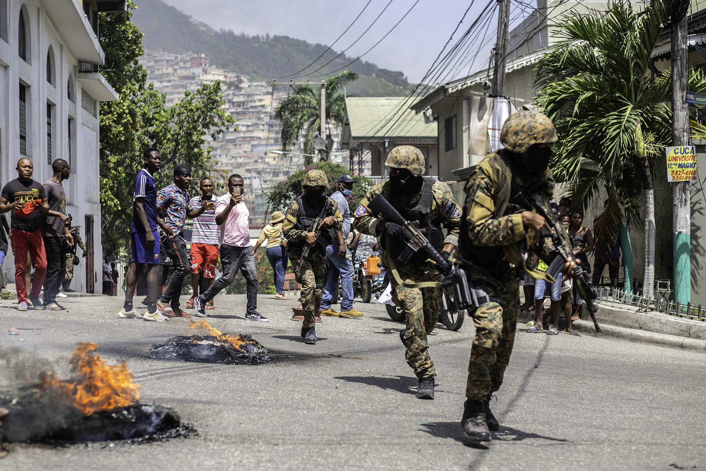Citizens take part in a protest near the police station of Petion Ville after Haitian president Jovenel Moïse was murdered in Port-au-Prince, Haiti, on July 8, 2021. (Richard Pierrin—Getty Images)