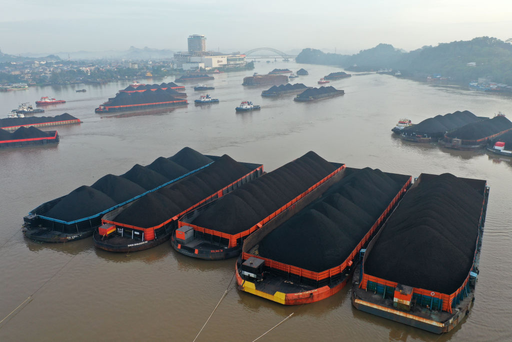 Barges transporting coal are moored on the Mahakam River in Samarinda, East Kalimantan, Indonesia, on Wednesday, Oct. 13, 2021. (Dimas Ardians—Bloomberg/Getty Images)