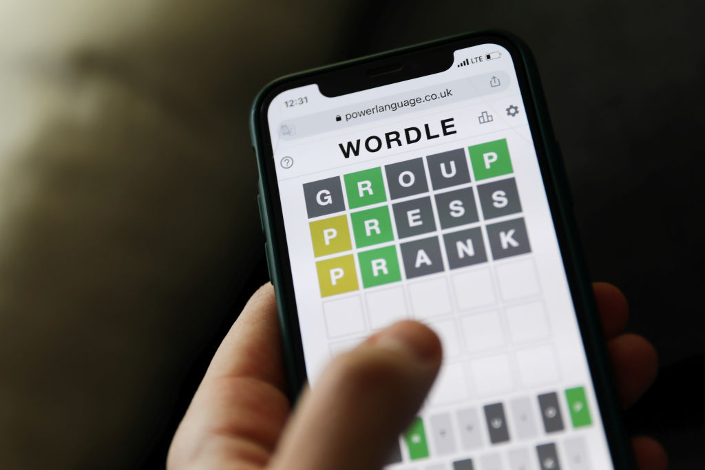 Wordle game displayed on a phone screen is seen in this illustration photo taken in Krakow, Poland on January 23, 2022. (Jakub Porzycki–NurPhoto/Getty Images)