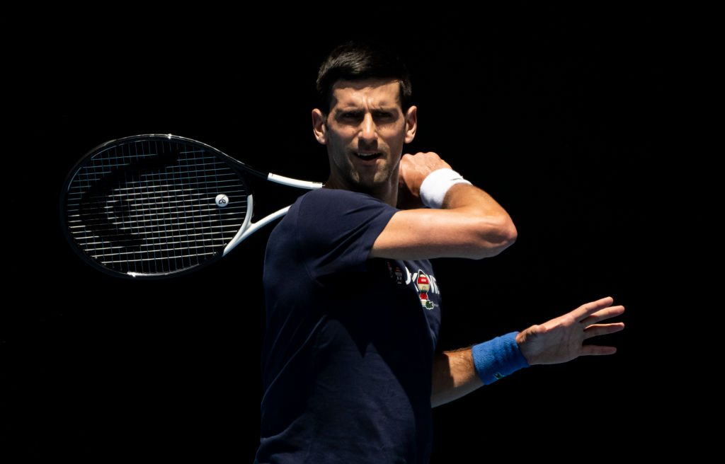 Novak Djokovic hits a forehand during a practice session ahead of the 2022 Australian Open at Melbourne Park on Jan. 12, 2022 in Melbourne, Australia. (TPN/Getty Images)