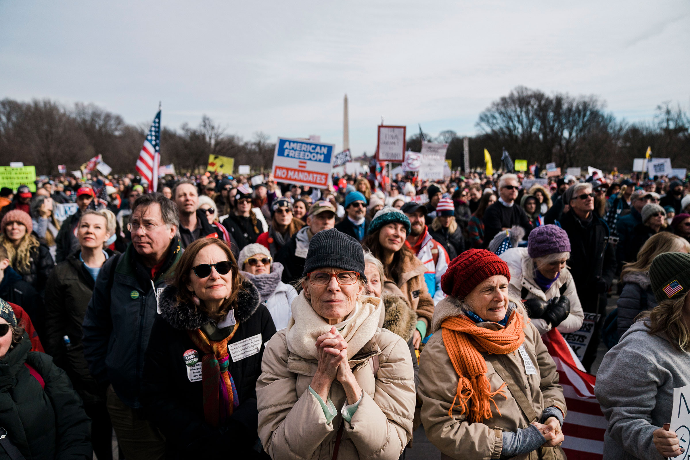 Jenny Burrill, of Brooklyn, NY and others listen to speakers during a Defeat the Mandates Rally, on National Mall in Washington, on Jan. 23, 2022. (Kent Nishimura—Los Angeles Times/Getty Images)