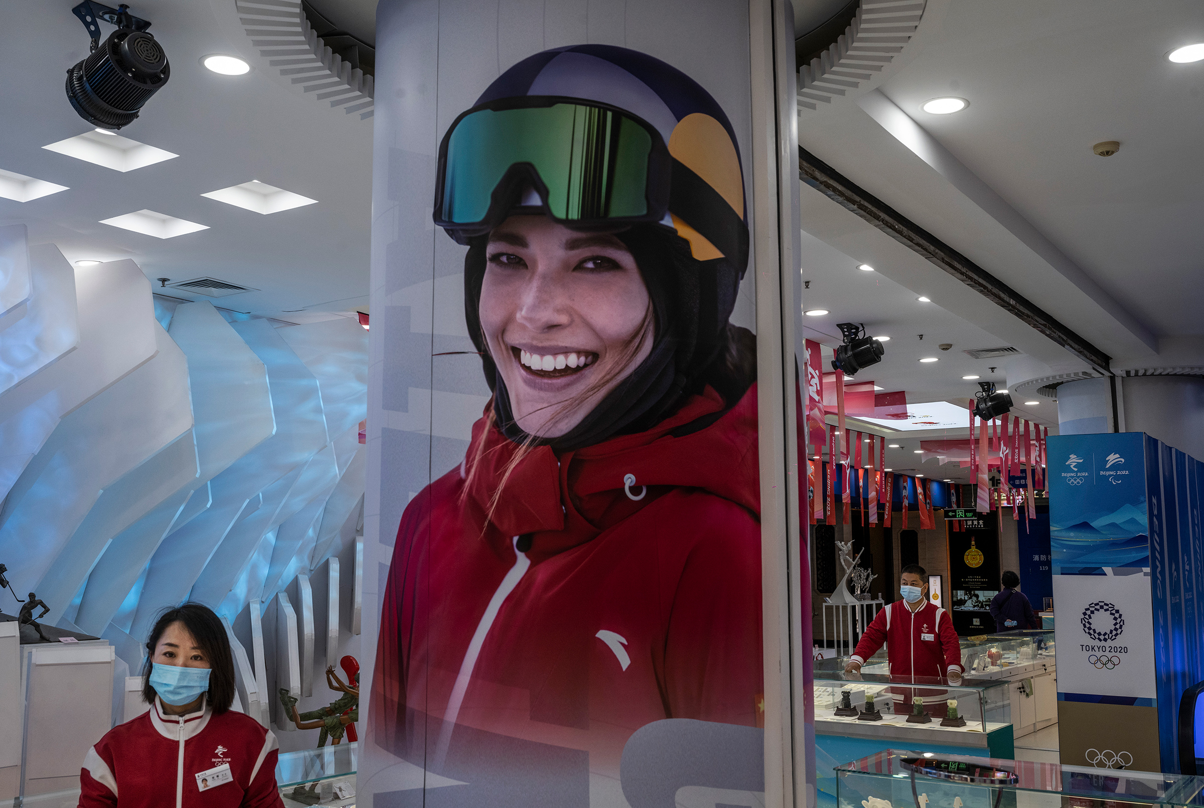 China’s “Snow Princess” beams from a poster at an Olympics merchandise store in Beijing (Kevin Frayer—Getty Images)