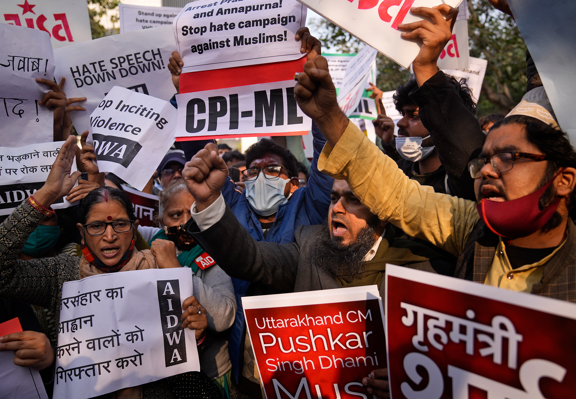 Demonstrators shout slogans during a protest against hate speech in New Delhi on Dec. 27, in reaction to a recent event at Haridwar, northern Uttarakhand where some leaders made communally sensitive speeches at a religious gathering (Manish Swarup—AP)