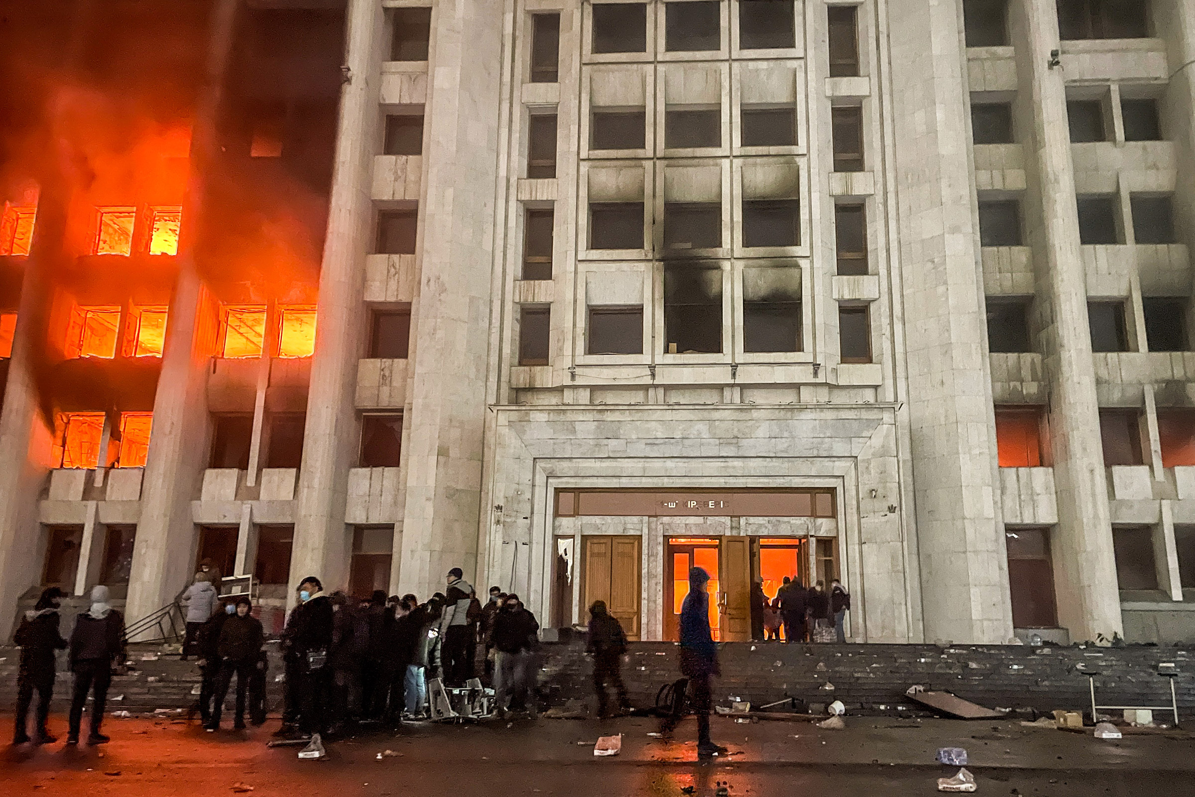 People protest outside the mayor's office in Almaty, Kazakhstan on Jan. 5, 2022. Protestors broke into the mayor's office and set it on fire. (Valery Sharifulin—TASS/Reuters)