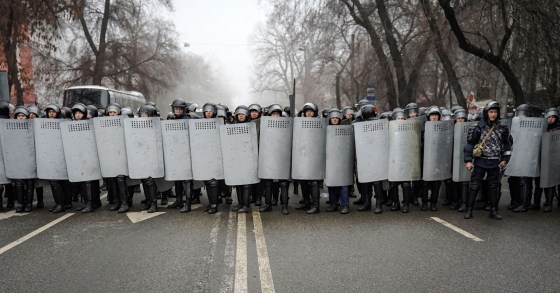 Riot police officers patrol in a street during rally over a hike in energy prices in Almaty, Kazakhstan, Jan. 5, 2022.