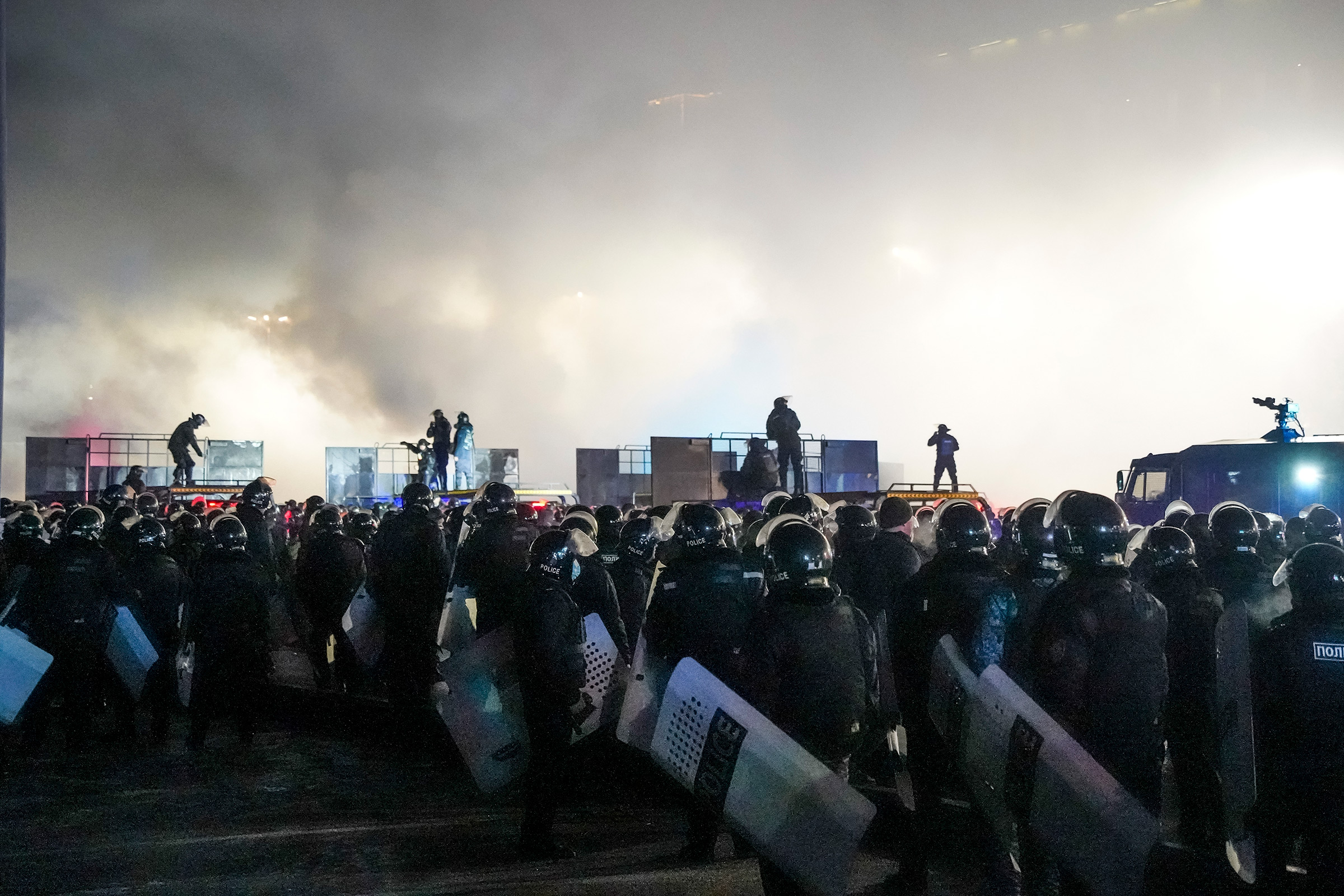 Riot police block protesters in the center of Almaty, Kazakhstan, Jan. 5, 2022. (Vladimir Tretyakov—AP)