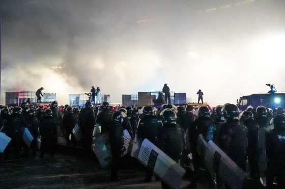 Riot police block protesters in the center of Almaty, Kazakhstan, Jan. 5, 2022. 