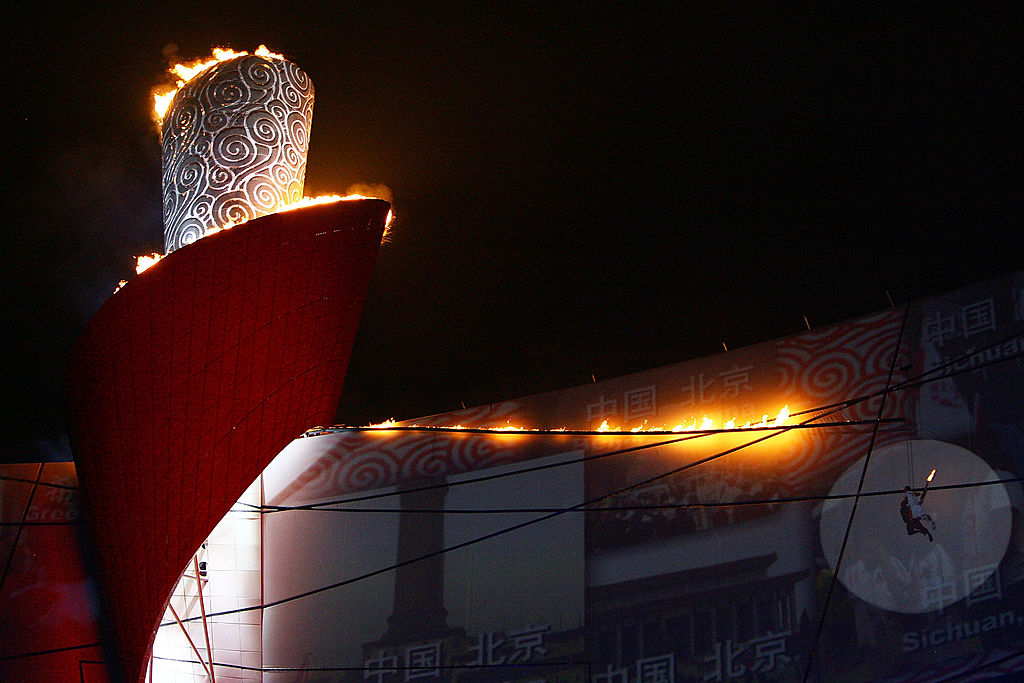 The Olympic Flame is lit by former Chinese gymnast Li Ning during the Opening Ceremony for the 2008 Beijing Summer Olympics at the National Stadium on Aug. 8, 2008 in Beijing, China. (Jeff Gross—Getty Images)
