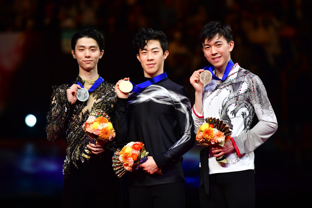 Silver medalist Yuzuru Hanyu of Japan, gold medalist Nathan Chen of the U.S. and bronze medalist Vincent Zhou of the U.S. after the medal ceremony for the Men's single at the 2019 ISU World Figure Skating Championships at Saitama Super Arena on March 23, 2019 in Saitama, Japan. (Atsushi Tomura—International Skating Union via Getty Images)