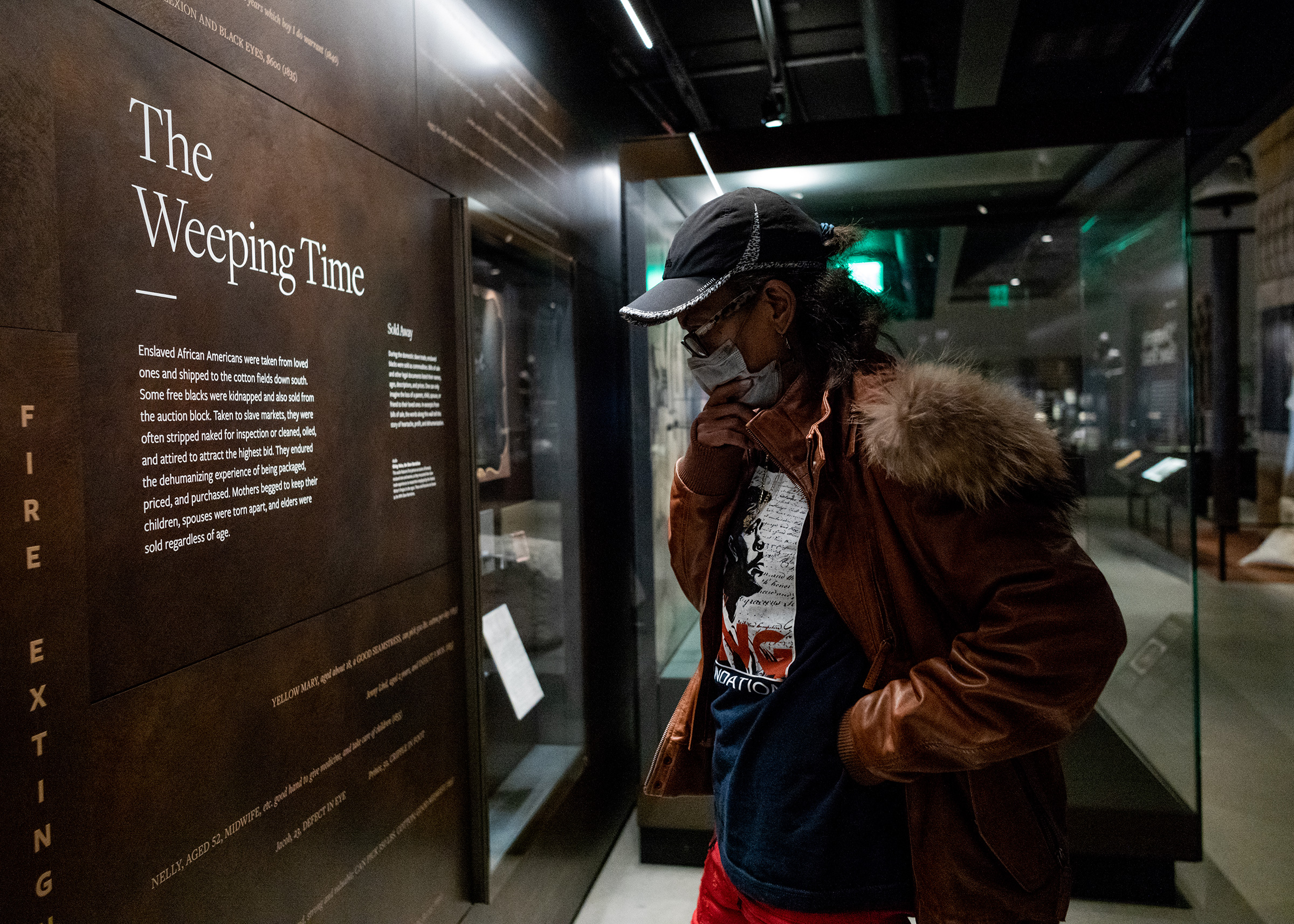 Dennetta King, ex-wife of Rodney King standsless than three feet away from a section of an auction block as she toured the National Museum of African American History and Culture