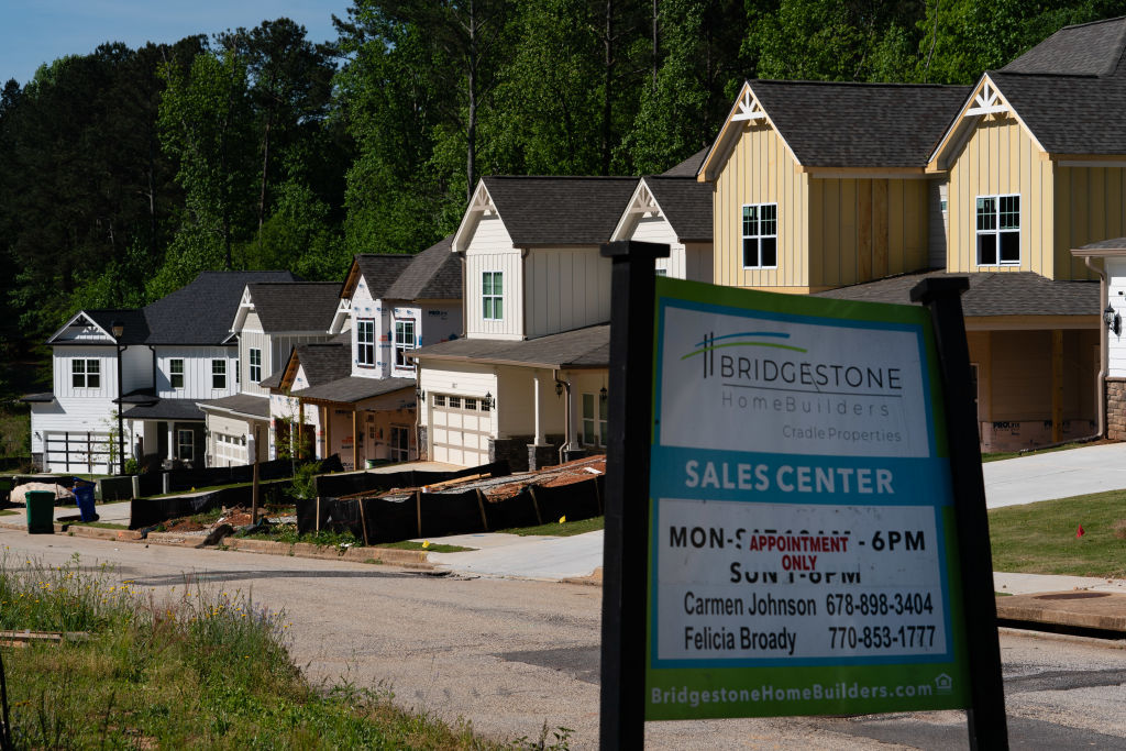 A sales center sign in front of a new residential community in Lithonia, Georgia, U.S., on Monday, April 26, 2021. (Elijah Nouvelage/Bloomberg—Getty Images)