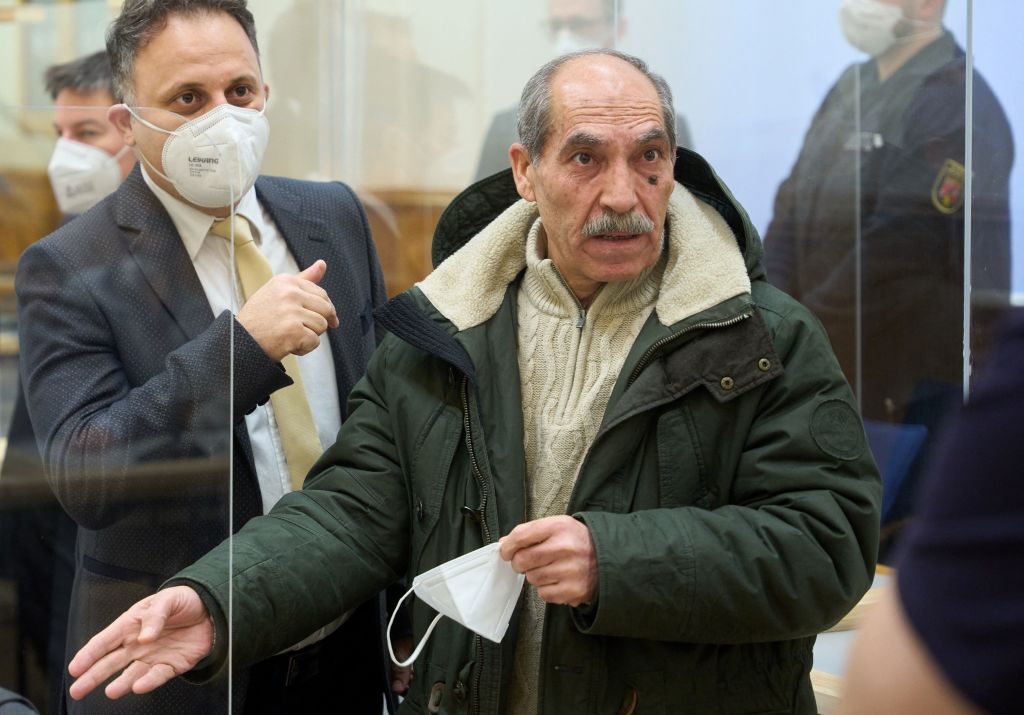 Former Syrian intelligence officer Anwar Raslan (right), gestures next to one of his lawyers at a courthouse in Koblenz, Germany, on Jan. 13, 2022 (Thomas Frey—AFP/Getty Images)