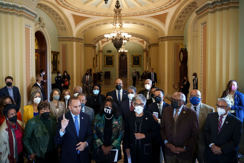 Surrounded by members of the Congressional Black Caucus, Rep. Hakeem Jeffries (D-NY) speaks to reporters about voting rights outside of the Senate Chamber at the U.S. Capitol in Washington, D.C. on January 19, 2022. (Drew Angerer—Getty Images)