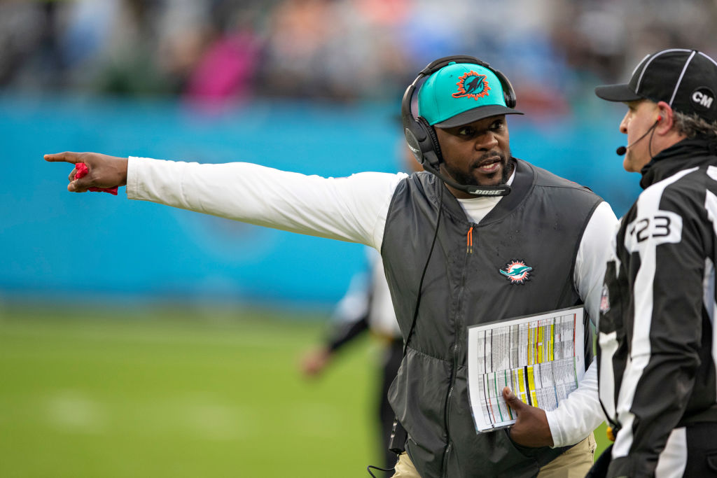 Former NFL Head Coach Brian Flores of the Miami Dolphins talked with an official during a game against the Tennessee Titans on January 2. (Wesley Hitt—Getty Images)