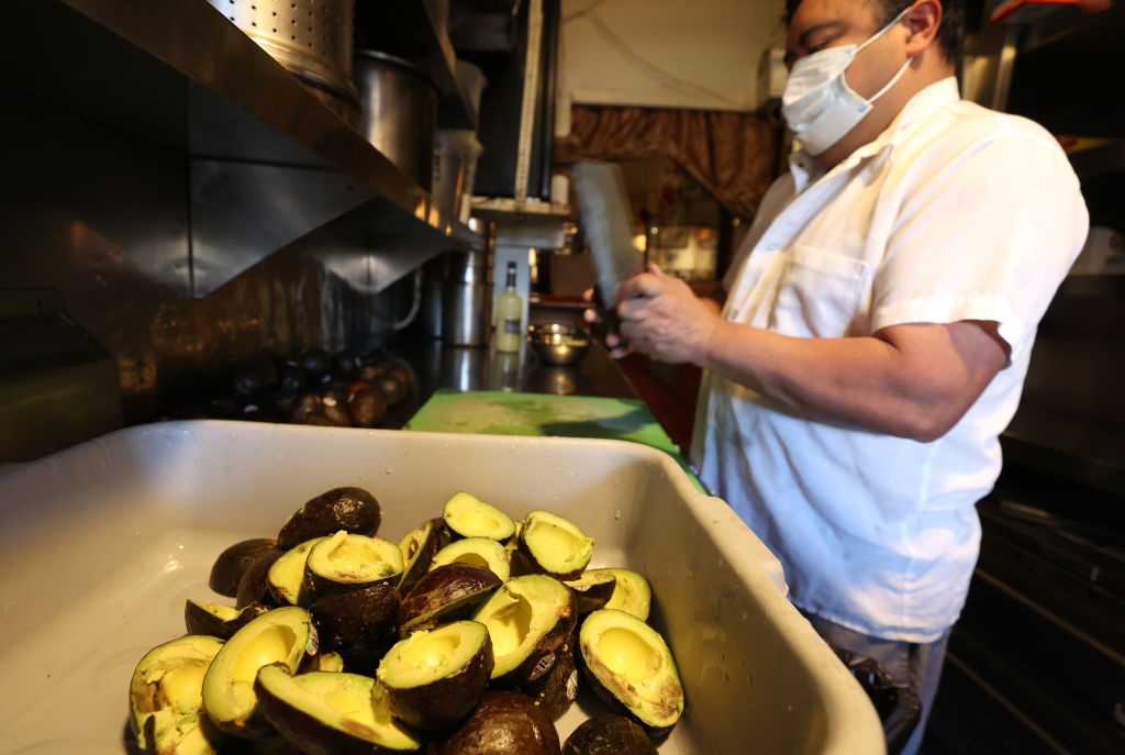 Jorge Granada prepares guacamole at Tommy's Mexican Restaurant on Feb. 09, 2022 in San Francisco, California. (Justin Sullivan/Getty Images)