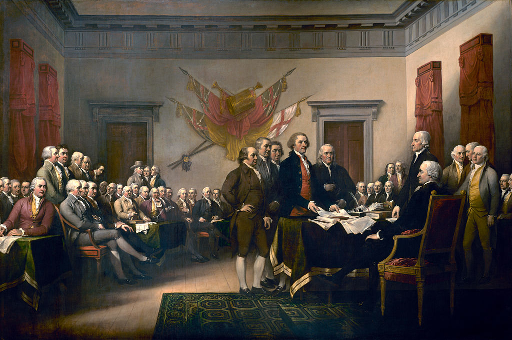 The signing of the Declaration of Independence in Philadelphia on July 4th, 1776 (by John Trumbull, American, 1756 - 1843), 1819. The painting shows the five-man drafting committee presenting the Declaration of Independence to the United States Congress, and is located in the Capitol rotunda. Oil on canvas. (GraphicaArtis/Getty Images)