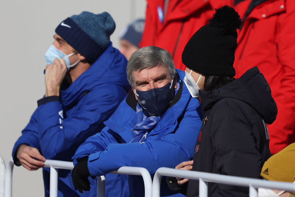 International Olympic Committee President Thomas Bach speaks with Peng Shuai prior to the Women's Freestyle Skiing Freeski Big Air Final on Day 4 of the Beijing 2022 Winter Olympic Games at Big Air Shougang on Feb. 8. 2022 in Beijing. (Richard Heathcote–Getty Images)