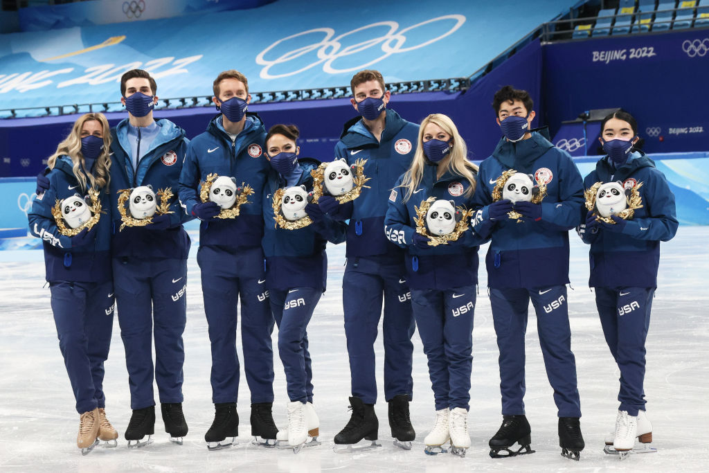 Silver medalists, Team USA pose for a photograph during a flower ceremony for the team figure skating competition at the 2022 Winter Olympic Games, at the Capital Indoor Stadium. (Valery Sharifulin–TASS/Getty Images)