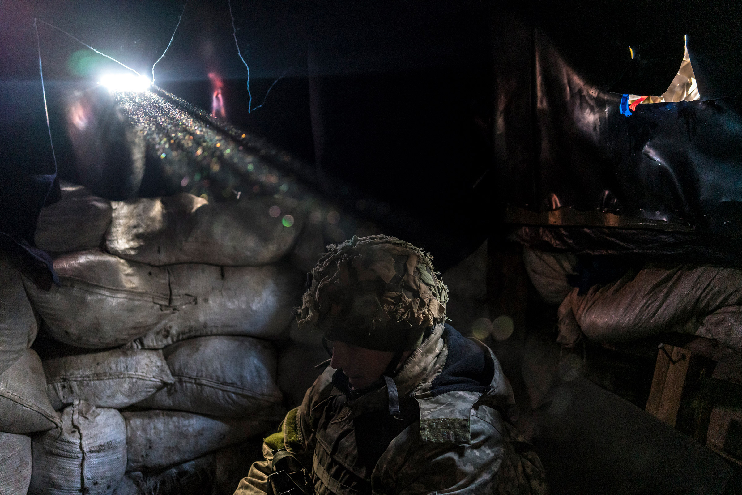 A member of the Ukrainian army’s 25th Airborne Brigade at the front line in Avdiivka on Dec. 2 (Brendan Hoffman—The New York Times/REDUX)