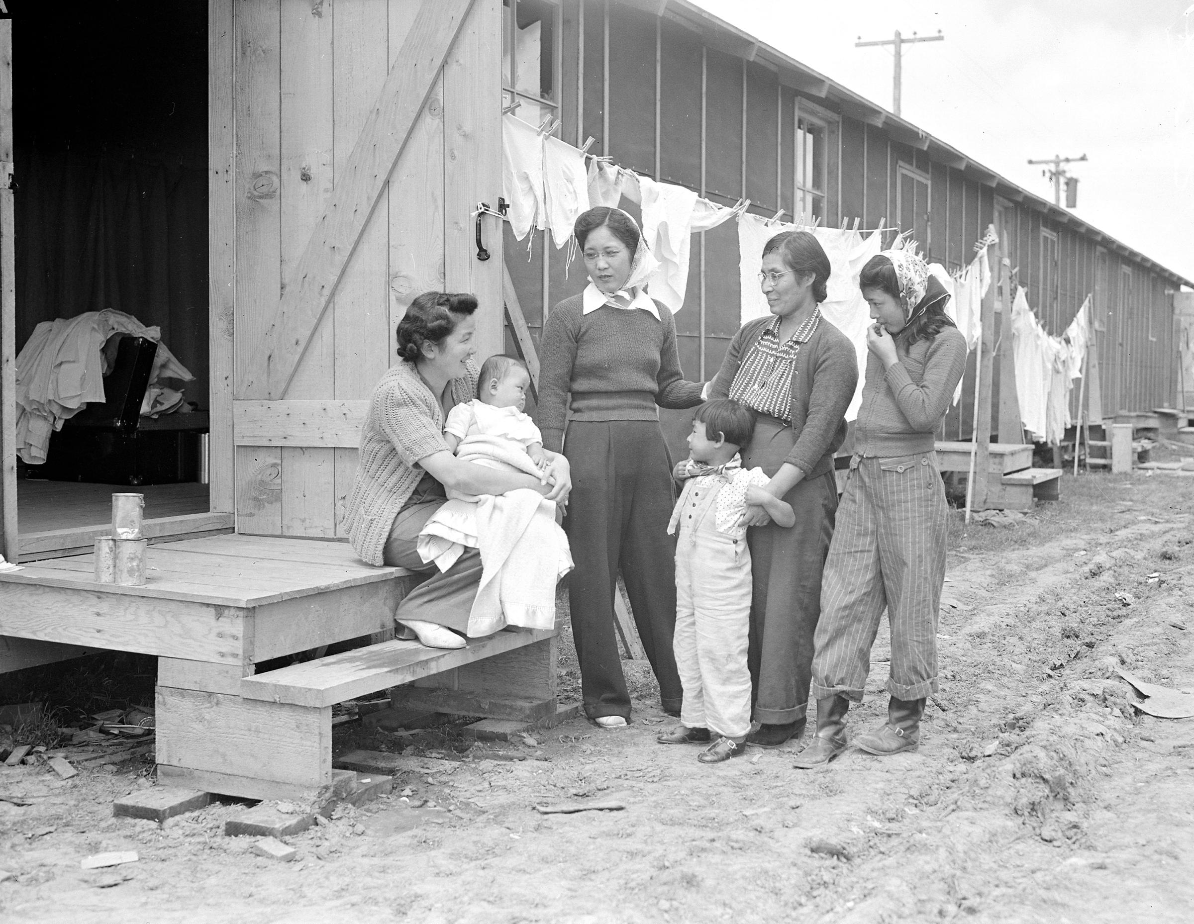 Salinas, California. Persons of Japanese ancestry at one of the assembly centers where they lived temporarily before being transferred to relocation centers 3/31/1942