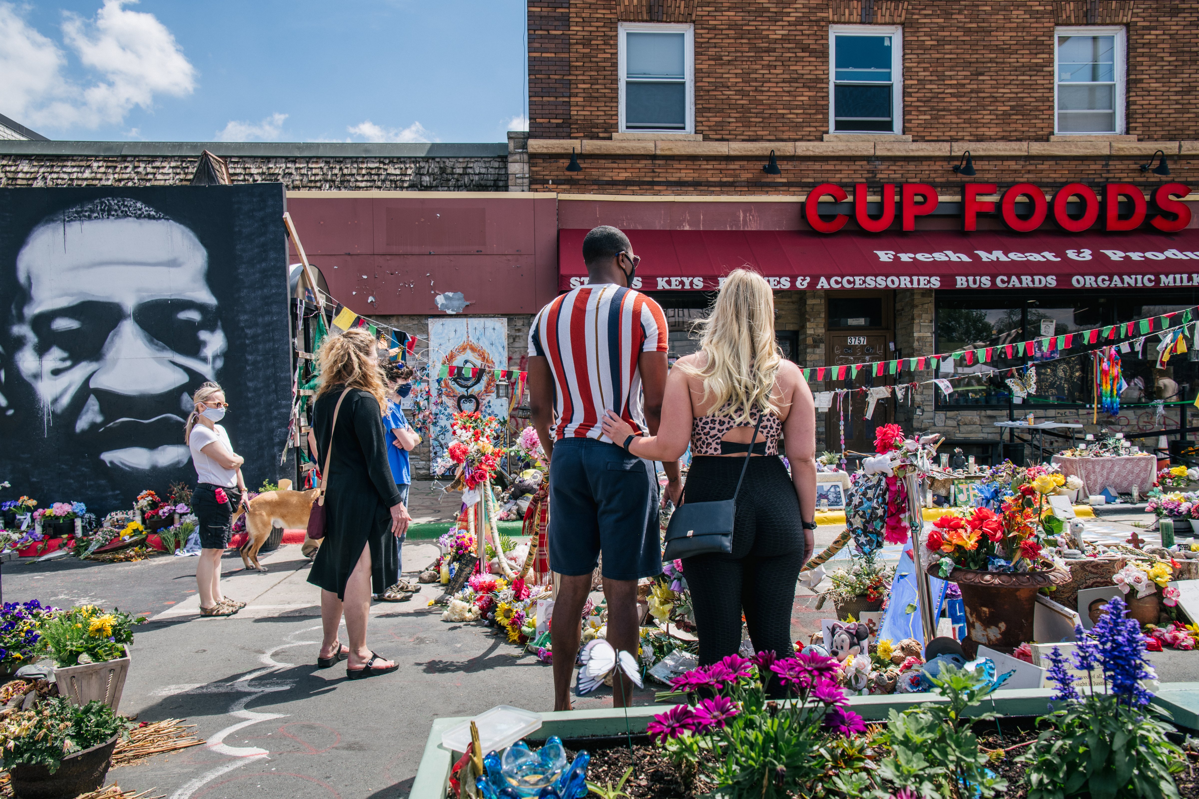 People pays their respects at George Floyd Square on May 25, 2021 in Minneapolis, Minnesota. (Brandon Bell—Getty Images)