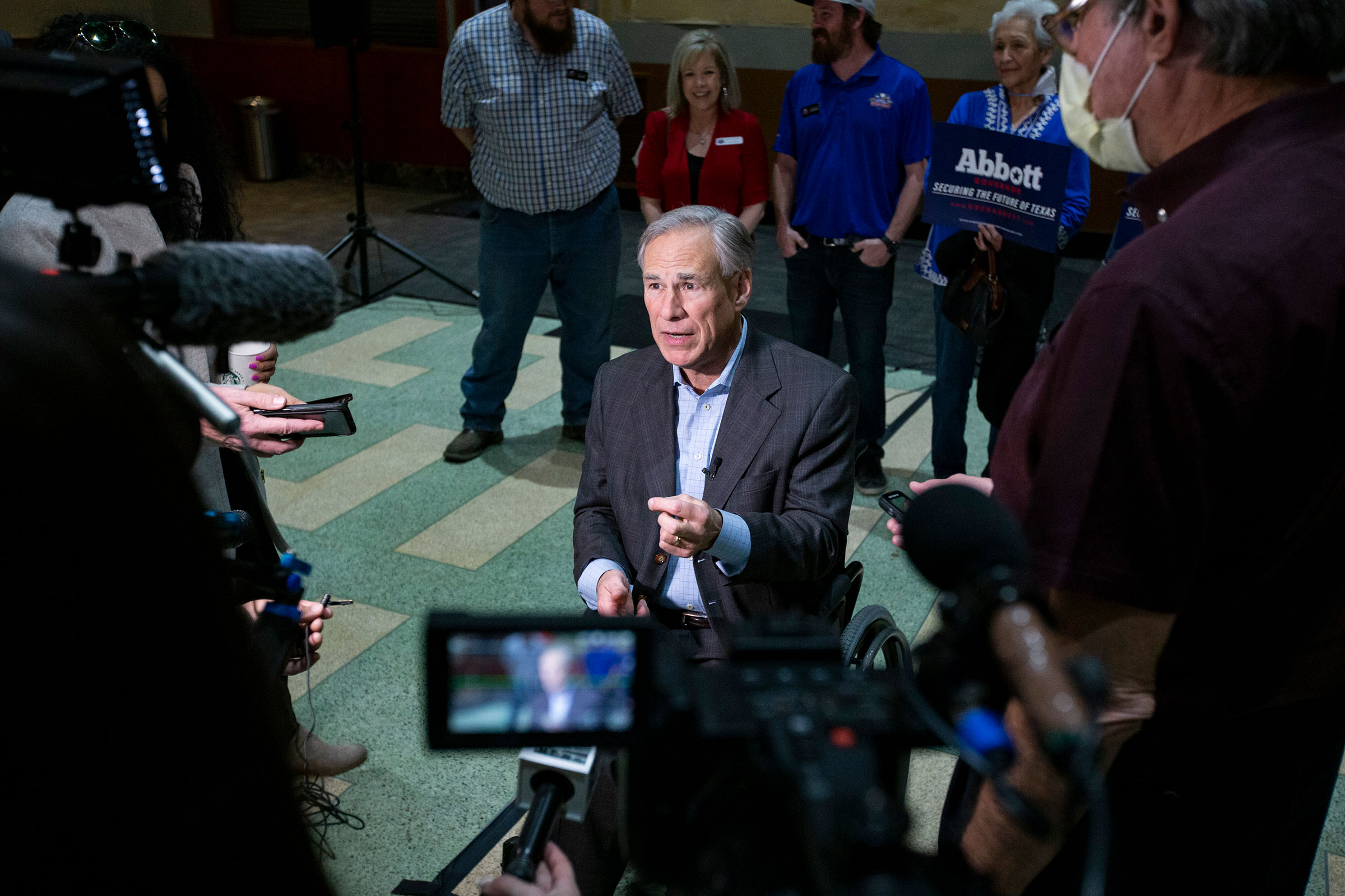 Texas Gov. Greg Abbott speaks to reporters in downtown Odessa, Tx. on Feb. 14, 2022. (Jacob Ford—Odessa American/AP)