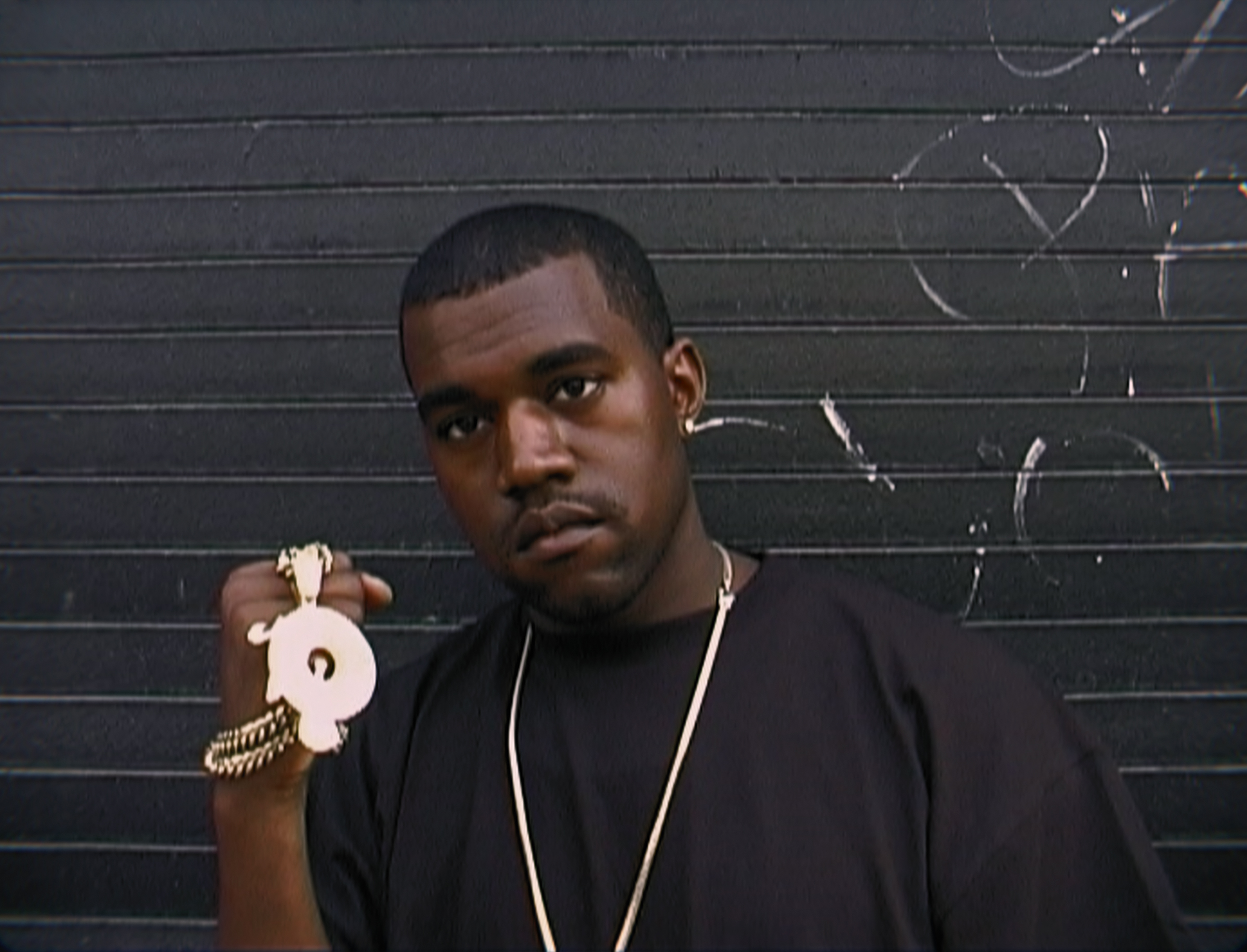 Kanye 'Ye' West with a Roc-A-Fella chain in <i>Jeen-yuhs: A Kanye Trilogy</i>. (Netflix)
